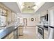 Well-equipped kitchen with stainless steel appliances and views to the dining area at 1058 Bounds St, Port Charlotte, FL 33952