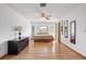Spacious main bedroom with wood floors, a ceiling fan, bay window and ample natural light at 1058 Bounds St, Port Charlotte, FL 33952