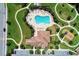 Overhead shot of pool, playground and clubhouse surrounded by sidewalks and landscaping at 12514 Goldenrod Ave, Bradenton, FL 34212