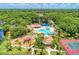 Aerial shot showcases community amenities, including pool, playground, and tennis courts at 12514 Goldenrod Ave, Bradenton, FL 34212