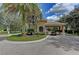 Guarded entrance to the community surrounded by mature trees and manicured landscaping at 12514 Goldenrod Ave, Bradenton, FL 34212