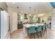 Spacious kitchen featuring modern appliances and a large island with barstool seating at 12514 Goldenrod Ave, Bradenton, FL 34212