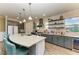 Modern kitchen featuring stainless steel appliances, a large island, and ample counter space at 12514 Goldenrod Ave, Bradenton, FL 34212