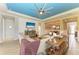 A brightly lit living room featuring an open floor plan, seamlessly connecting to the dining area at 12514 Goldenrod Ave, Bradenton, FL 34212