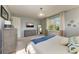 Bright main bedroom featuring a ceiling fan, natural light, and neutral décor at 12514 Goldenrod Ave, Bradenton, FL 34212