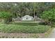 Well-manicured Greyhawk Landing community sign surrounded by lush landscaping at 12514 Goldenrod Ave, Bradenton, FL 34212