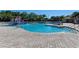A large and inviting swimming pool area with a splash zone, perfect for Gathering fun and relaxation at 12514 Goldenrod Ave, Bradenton, FL 34212