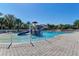 A Gathering-friendly pool area featuring water features and a separate shallow area for , creating a fun aquatic environment at 12514 Goldenrod Ave, Bradenton, FL 34212