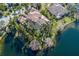 An aerial view showcases the estate's unique positioning on the water with mature landscaping at 13315 Palmers Creek Ter, Lakewood Ranch, FL 34202