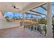 Spacious balcony with an ornate railing, decorative columns, and a view of the surrounding neighborhood at 13315 Palmers Creek Ter, Lakewood Ranch, FL 34202