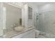 Bright bathroom features marble counters, stylish vessel sink, and beautiful walk-in glass shower at 13315 Palmers Creek Ter, Lakewood Ranch, FL 34202