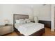 Comfortable bedroom features a large bed, neutral colors, and side tables with lamps at 13315 Palmers Creek Ter, Lakewood Ranch, FL 34202