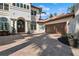 Charming home featuring a brick driveway leading to a two-car garage, and a decorative front entryway at 13315 Palmers Creek Ter, Lakewood Ranch, FL 34202