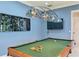 Game room with Tiffany style lighting fixture and custom wall decor at 13315 Palmers Creek Ter, Lakewood Ranch, FL 34202
