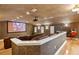 Home theater with a large screen, comfortable seating, and ambient lighting at 13315 Palmers Creek Ter, Lakewood Ranch, FL 34202