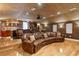 Well-appointed home theater featuring a wet bar, comfortable seating, and ample lighting at 13315 Palmers Creek Ter, Lakewood Ranch, FL 34202