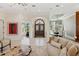 Spacious living room with tile flooring, and large windows with natural light at 13315 Palmers Creek Ter, Lakewood Ranch, FL 34202