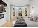 Main bedroom featuring three arched windows and a fireplace at 13315 Palmers Creek Ter, Lakewood Ranch, FL 34202