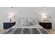 Nicely staged main bedroom with matching nightstands and a decorative throw at 13315 Palmers Creek Ter, Lakewood Ranch, FL 34202