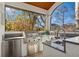 An outdoor kitchen with stainless steel appliances, sink, and outdoor views at 13315 Palmers Creek Ter, Lakewood Ranch, FL 34202