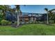 A spacious backyard boasts a pool, patio, and beautifully landscaped perimeter for privacy at 14510 Leopard Creek Pl, Lakewood Ranch, FL 34202