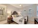 Bedroom featuring shuttered windows, and beautiful lamps on the bedside tables at 14510 Leopard Creek Pl, Lakewood Ranch, FL 34202