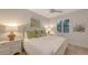 Bright bedroom featuring white wood furnishings, a ceiling fan, and tasteful decor at 14510 Leopard Creek Pl, Lakewood Ranch, FL 34202