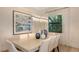 Bright dining room featuring a modern light fixture, elegant decor, and seating for six at 14510 Leopard Creek Pl, Lakewood Ranch, FL 34202