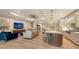 Open living space with elegant furnishings connecting the kitchen to the comfortable living room area at 14510 Leopard Creek Pl, Lakewood Ranch, FL 34202