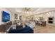 Spacious living space with hardwood floors, an open-concept design, and a modern kitchen at 14510 Leopard Creek Pl, Lakewood Ranch, FL 34202