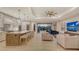 Bright living space with a kitchen, dining area, living room, and sliding glass doors at 14510 Leopard Creek Pl, Lakewood Ranch, FL 34202