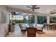 A screened-in patio offers a pool, lounge seating, BBQ, and dining spaces for entertaining at 14510 Leopard Creek Pl, Lakewood Ranch, FL 34202