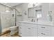 Modern bathroom featuring a glass enclosed shower, white vanity, and modern fixtures at 1500 State St # 305, Sarasota, FL 34236