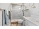 Bathroom featuring glass enclosed shower, white vanity with double sinks, and tile flooring at 1500 State St # 305, Sarasota, FL 34236