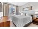 Well-lit bedroom featuring large windows with curtains and modern decor at 1500 State St # 305, Sarasota, FL 34236