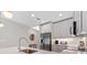 Bright kitchen with stainless steel refrigerator and modern fixtures at 1500 State St # 305, Sarasota, FL 34236