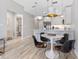 Bright kitchen with stainless steel appliances, white cabinetry, and modern pendant lighting at 1500 State St # 305, Sarasota, FL 34236