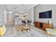 A modern living room with a view into the kitchen area at 1500 State St # 305, Sarasota, FL 34236