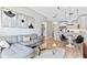 Stylish living room with modern furniture, art, and an open layout leading to the kitchen at 1500 State St # 305, Sarasota, FL 34236