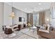 Charming living room with city view balcony, modern furniture, and stylish decor at 1500 State St # 305, Sarasota, FL 34236