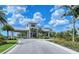 Guard house entrance to the community with lush landscaping and mature palm trees at 15115 Montello Way, Lakewood Ranch, FL 34211