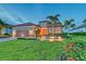 Inviting two-story home with manicured lawn, landscape lighting, and a tiled roof at 15115 Montello Way, Lakewood Ranch, FL 34211