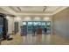 Well-equipped fitness area with various weights, machines, and a punching bag, offering a comprehensive workout space at 15115 Montello Way, Lakewood Ranch, FL 34211
