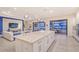 Open-concept kitchen with large island, modern appliances, and seamless transition to the outdoor living space at 15115 Montello Way, Lakewood Ranch, FL 34211