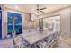 Covered outdoor kitchen and dining area features a grill and seating for up to eight people at 15115 Montello Way, Lakewood Ranch, FL 34211