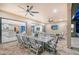 Spacious outdoor patio features an outdoor dining area and comfortable seating with access to the home's interior at 15115 Montello Way, Lakewood Ranch, FL 34211