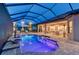 Relaxing pool area with shaded seating and views of a lush green golf course at 15115 Montello Way, Lakewood Ranch, FL 34211