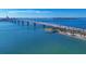 Stunning aerial capture of the coastline featuring a bridge, beach and marina at 1771 Ringling Blvd # 703, Sarasota, FL 34236