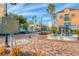 A quaint streetscape featuring Burns Court Herald Square sign and a building with colorful details at 1771 Ringling Blvd # 703, Sarasota, FL 34236