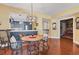 Eat-in dining room with hardwood floors and chandelier at 1771 Ringling Blvd # 703, Sarasota, FL 34236